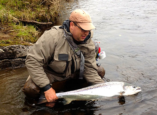 Ben Bilello with a salmon he caught