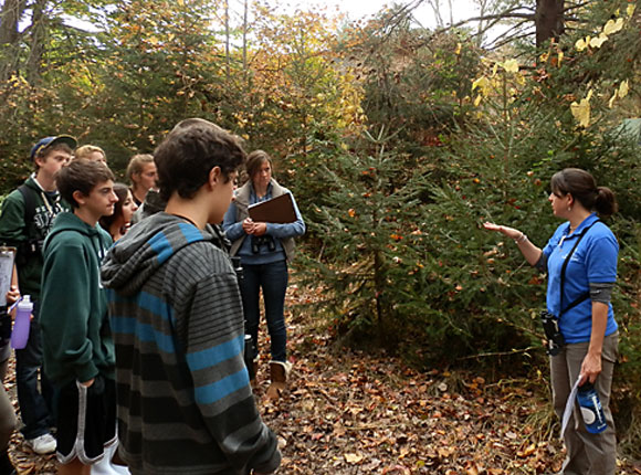 A teacher-naturalist leads a program on the trails of the Connecticut Audubon Society's Fairfield site. More people interested in sharing their knowledge and love of nature are needed.