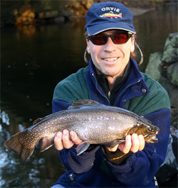 Ron Merly with a salter brook trout he caught.