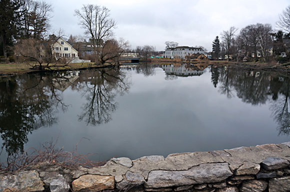 Beneath the surface of the lower Mill River lies lead and other waste from the former Exide battery plant. The company has announced a plan to clean the river, but some neighbors and conservationists fear what the work could stir up. (Fairfield Sun/Shawn O'Sullivan)