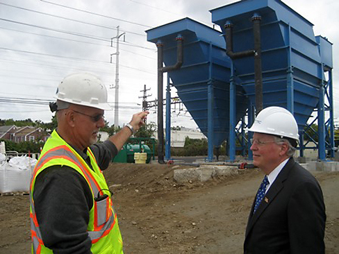 Barry Culp, senior project manager for TRC showing First Selectman Mike Tetreau the clarifiers at the clean up site.
