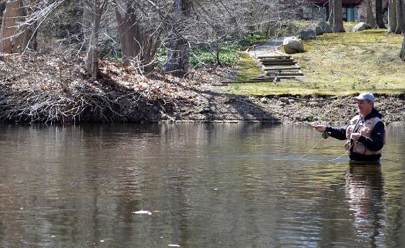 Tom O'Donnell was one the fisherman enjoying spring-like weather Saturday at the William ìDocî Skerlick Saugatuck River Trout Management Area on Saturday. Photo: Jarret Liotta