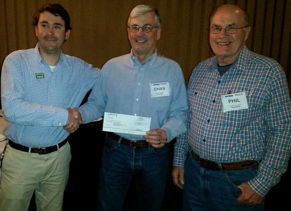 Pat Fowler presents a grant from Orvis to Nutmeg TU President Charles Petruccelli and Treasurer Phil Jacques.