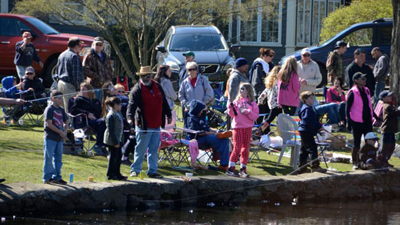 Families gather at a Milford Children's Trout Derby. — Milford Mirror Photo