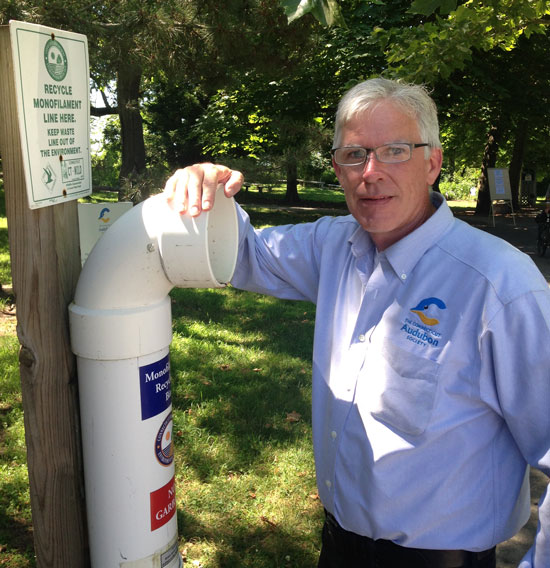 Connecticut Audubon Society Executive Director Patrick Comins checks out a fishing line recycling container at Milford Point. Similar containers will soon be installed as part of a project also involving Black Rock In The Know, the Ash Creek Conservation Association, the Town of Fairfield, the City of Bridgeport, and the landowners or occupants of the land on which the bins are being placed. The Connecticut Department of Energy and Environmental Protection is collecting the line for recycling.